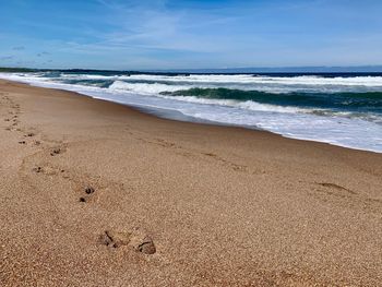 Scenic view of beach against sky