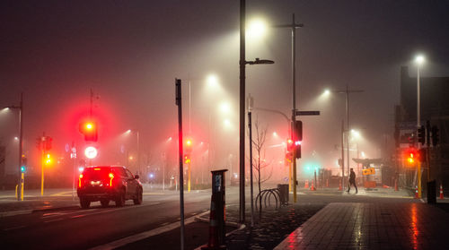 Illuminated street lights at night