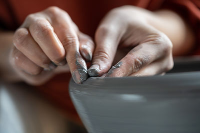 Cropped hand of man working in workshop