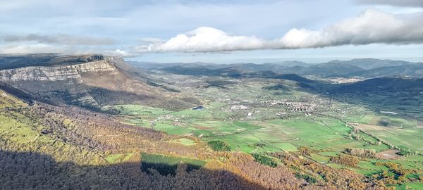 Aerial view of landscape and mountains against sky