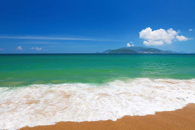 Scenic view of sea against blue sky