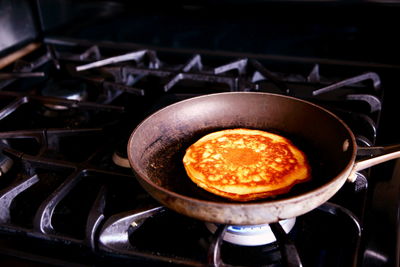 Close-up of pan cake being cooked on pan