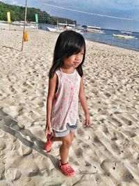 Woman standing on beach