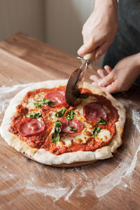 Close-up of person preparing food on table