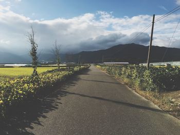 Road amidst landscape against sky