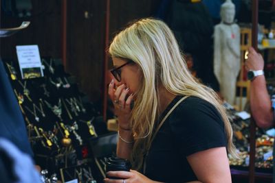 Side view of woman shopping at market