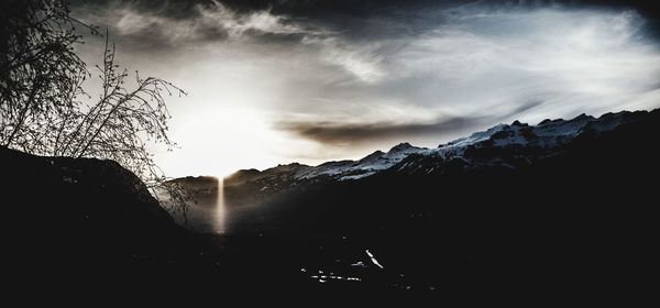 Scenic view of silhouette mountains against sky