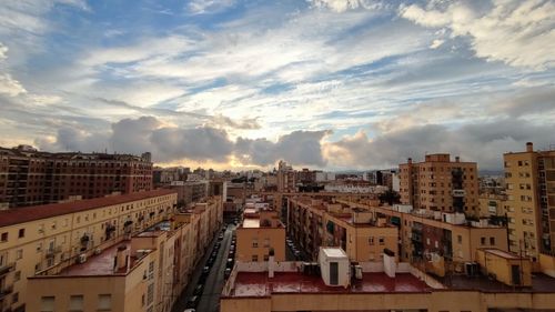 High angle view of buildings in city against sky