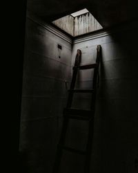 Ladder on wall in darkroom