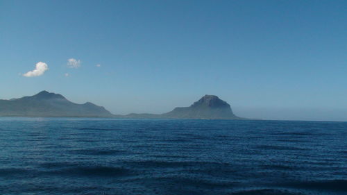 Scenic view of sea against clear blue sky