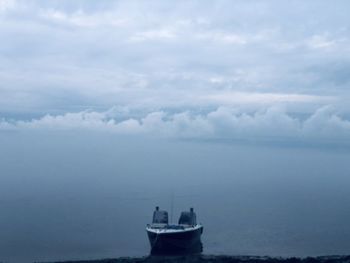 Boat in sea against sky