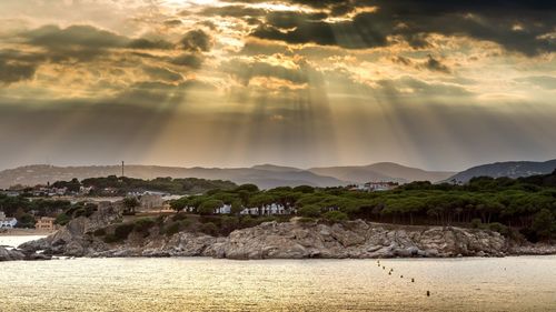 Scenic view of sea against sky at sunset