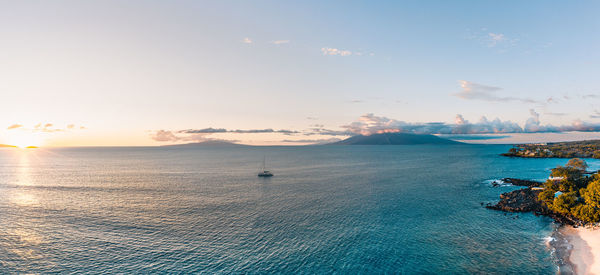 Scenic view of sea against sky at sunset