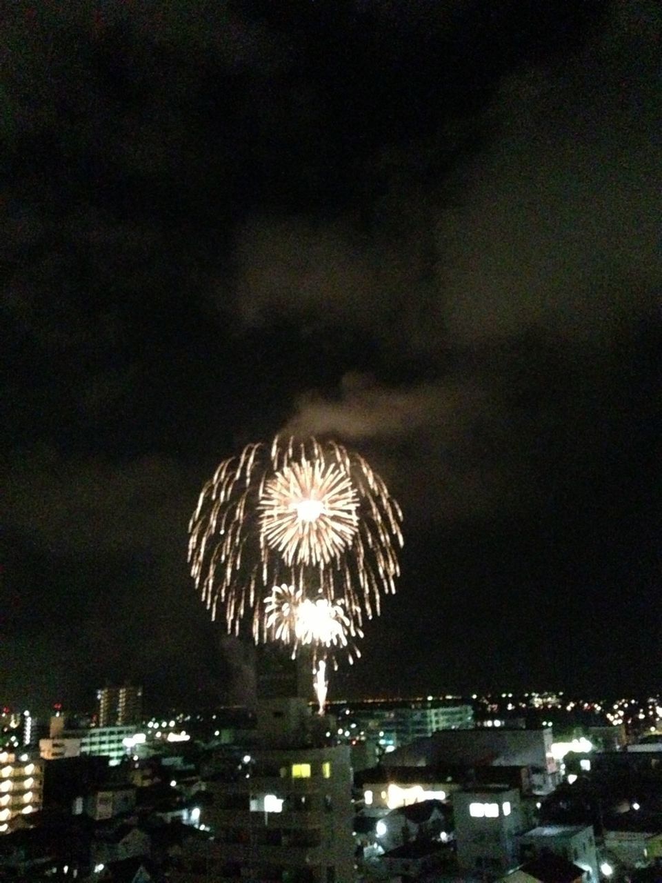 night, illuminated, firework display, exploding, sky, celebration, long exposure, glowing, firework - man made object, sparks, arts culture and entertainment, water, firework, motion, cityscape, city, outdoors, no people, river, building exterior