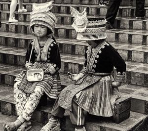 Boy sitting outdoors