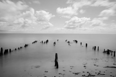 Scenic view of sea against cloudy sky