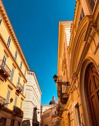 Low angle view of buildings against clear sky