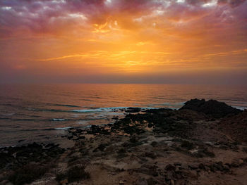 Scenic view of sea against sky during sunset