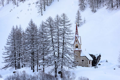 Snow covered landscape against mountain