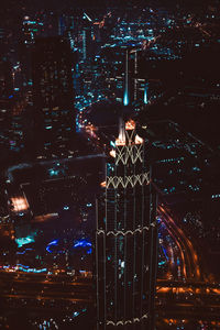 High angle view of city lit up at night