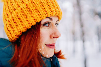 Close-up of young woman wearing knit hat