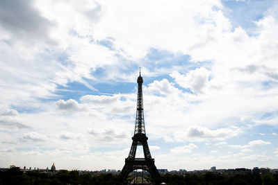 Low angle view of tower against cloudy sky