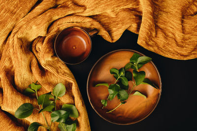 High angle view of vegetables and leaves on table