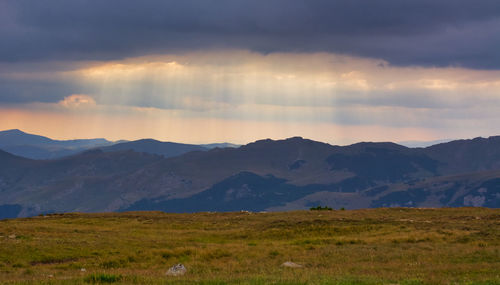 Scenic view of landscape and mountains against sky