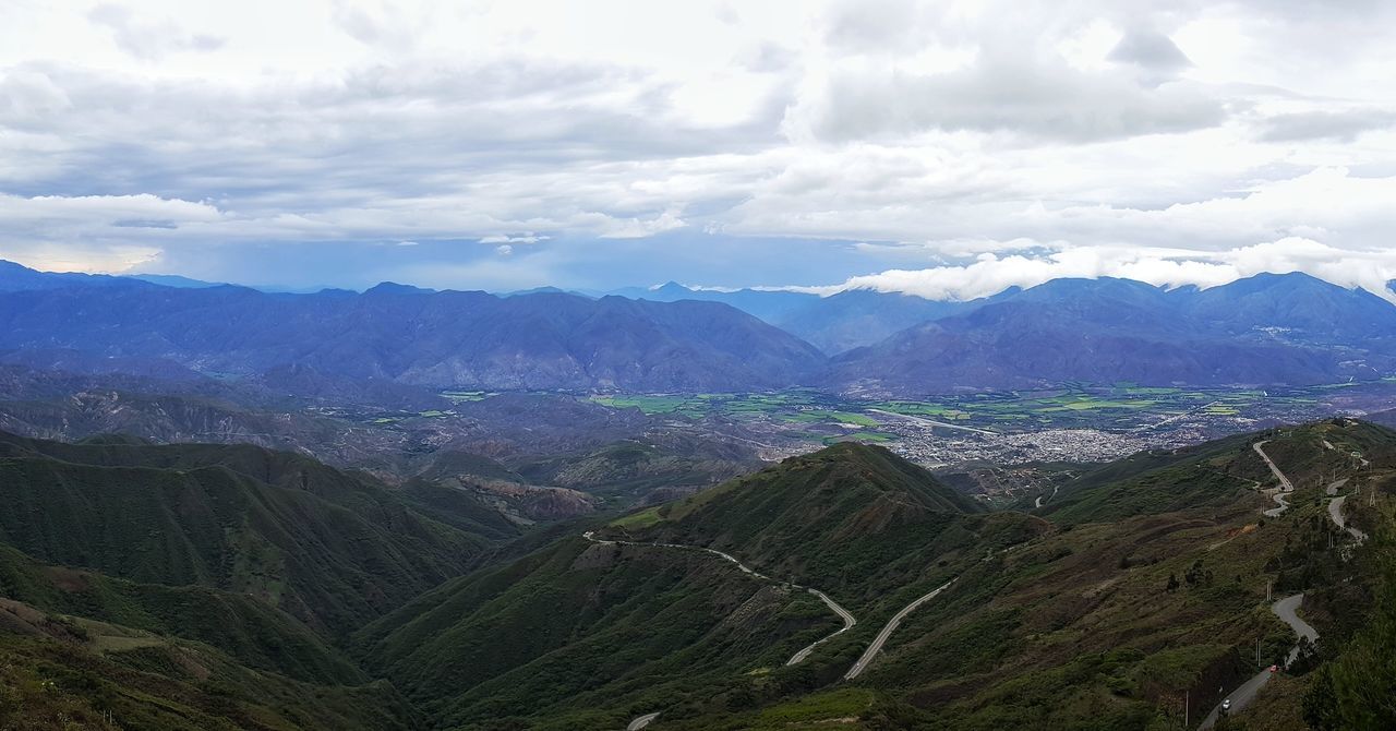 cloud - sky, agriculture, mountain, sky, landscape, social issues, nature, beauty in nature, field, farm, high angle view, outdoors, scenics, rural scene, tranquil scene, tree, beauty, mountain range, aerial view, sunset, tranquility, no people, terraced field, day, lush - description