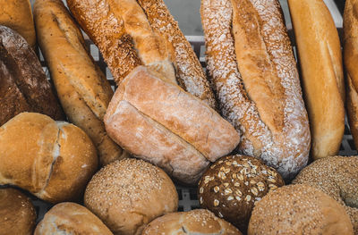 Various types of freshly baked bread arranged in the crate