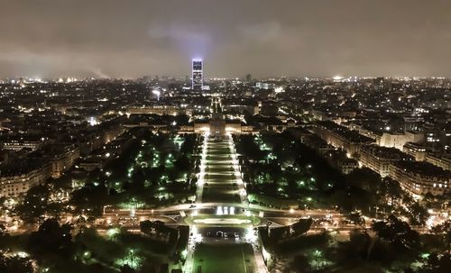 High angle view of illuminated buildings in city at night