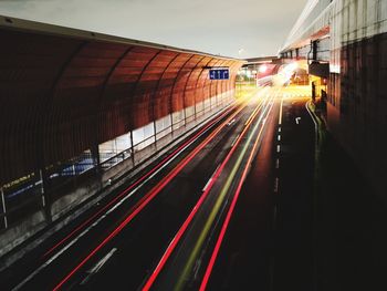 Light trails on railroad tracks in city