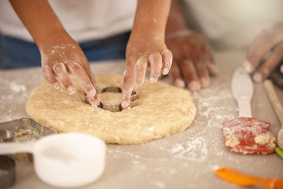 Cropped hand of person preparing food