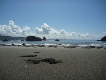 Scenic view of sea against blue sky