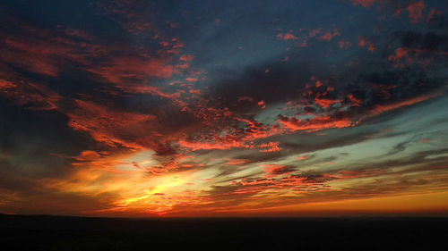 Low angle view of dramatic sky during sunset