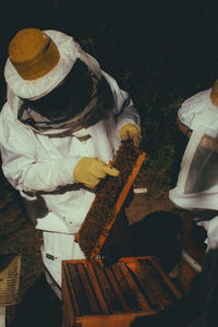 Low section of man working at farm