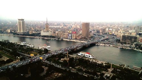 High angle view of city at riverbank