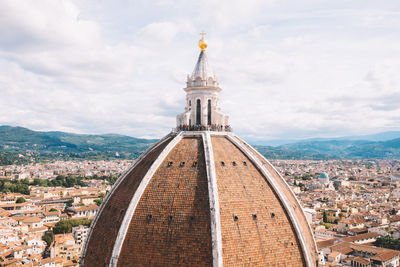 Dome of duomo santa maria del fiore against cloudy sky