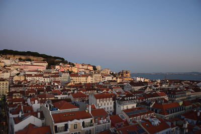 Town by sea against sky in city