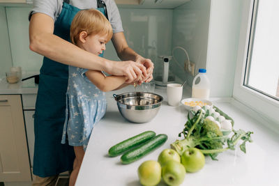 Midsection of man preparing food