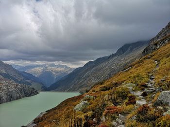 Scenic view of lake and mountains against sky