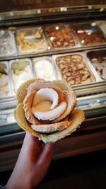 Close-up of hand holding ice cream