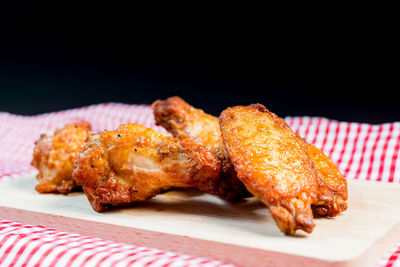 Close-up of fried chicken on cutting board