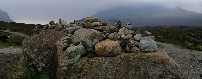 View of rocks on mountain against sky