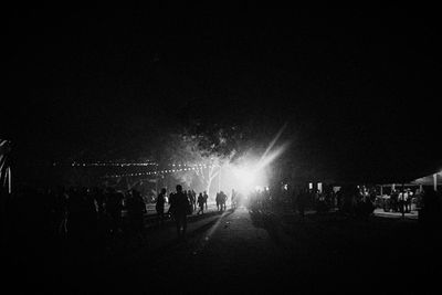 Blurred motion of illuminated people at night