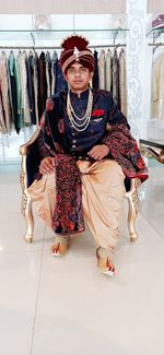 Portrait of woman wearing mask in store