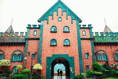 Man in front of historic building