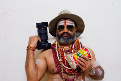 Full length portrait of man wearing sunglasses