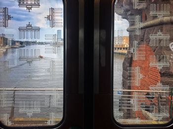 Buildings seen through glass window