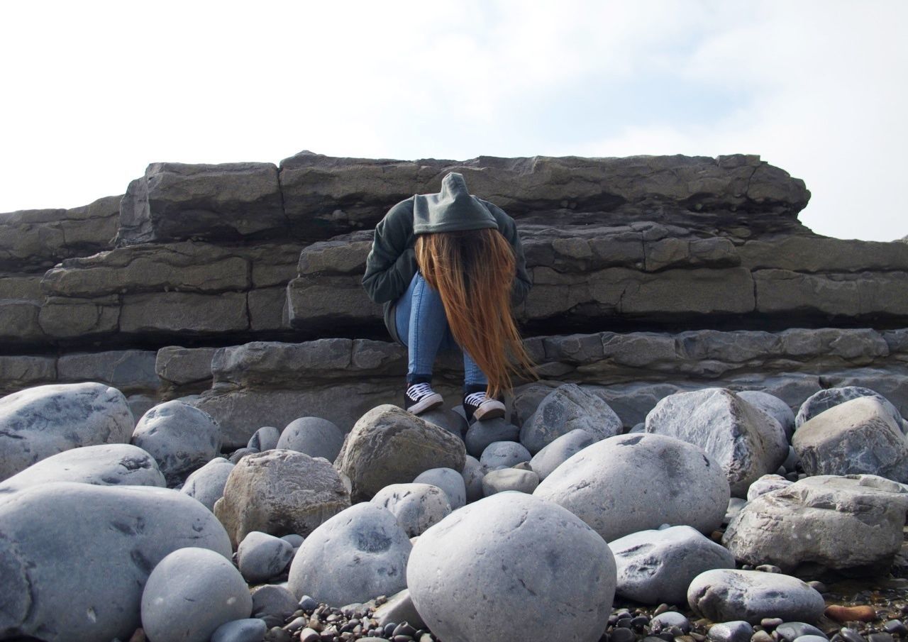 rock - object, stone - object, sky, stone wall, rock, built structure, stone, rock formation, architecture, rear view, day, lifestyles, stack, men, pebble, person, outdoors, standing